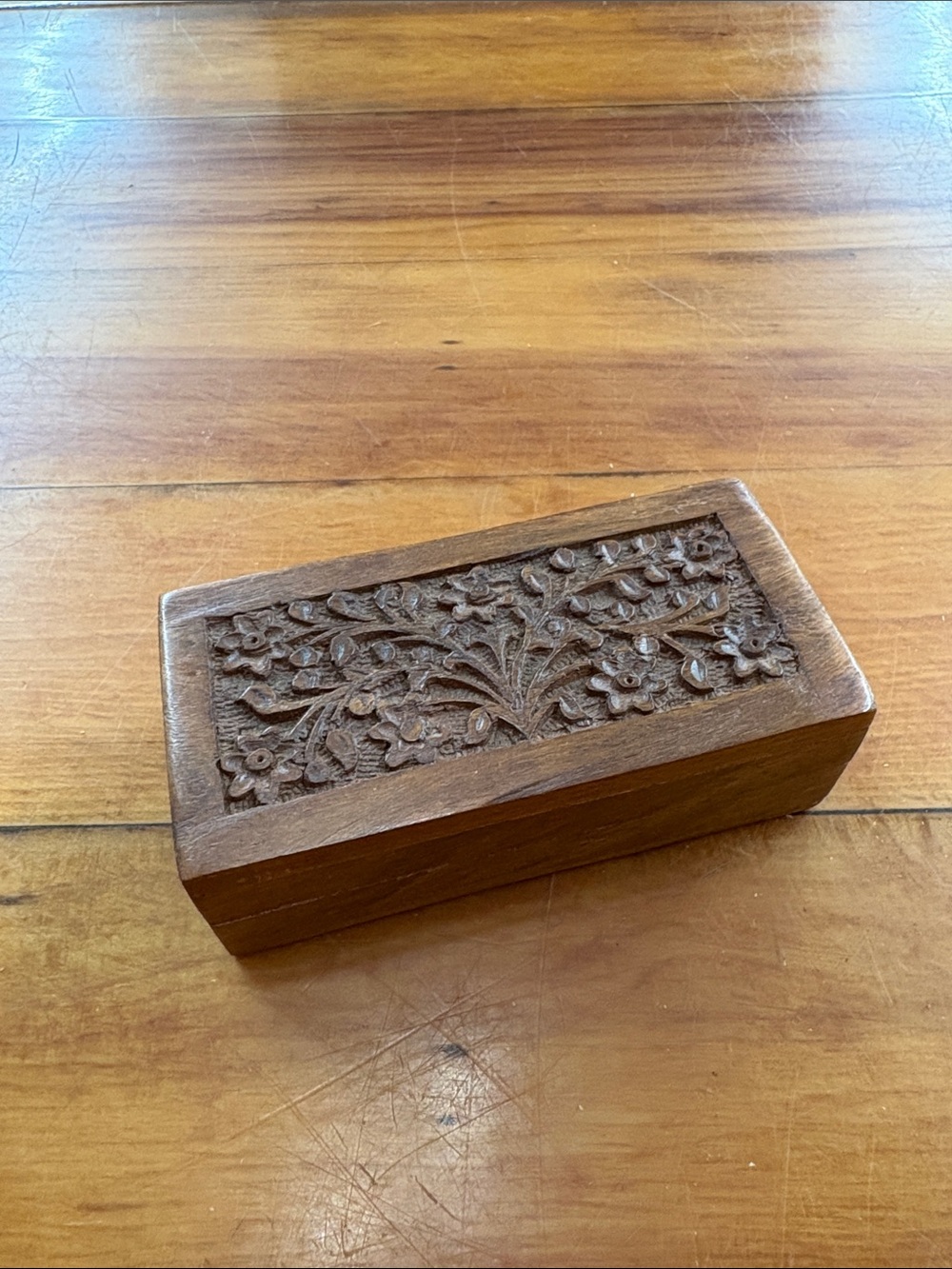 Vintage hand-carved wooden trinket box made in India with a floral design